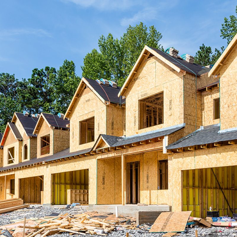 New Row House Construction with wood sheathing and asphalt roof