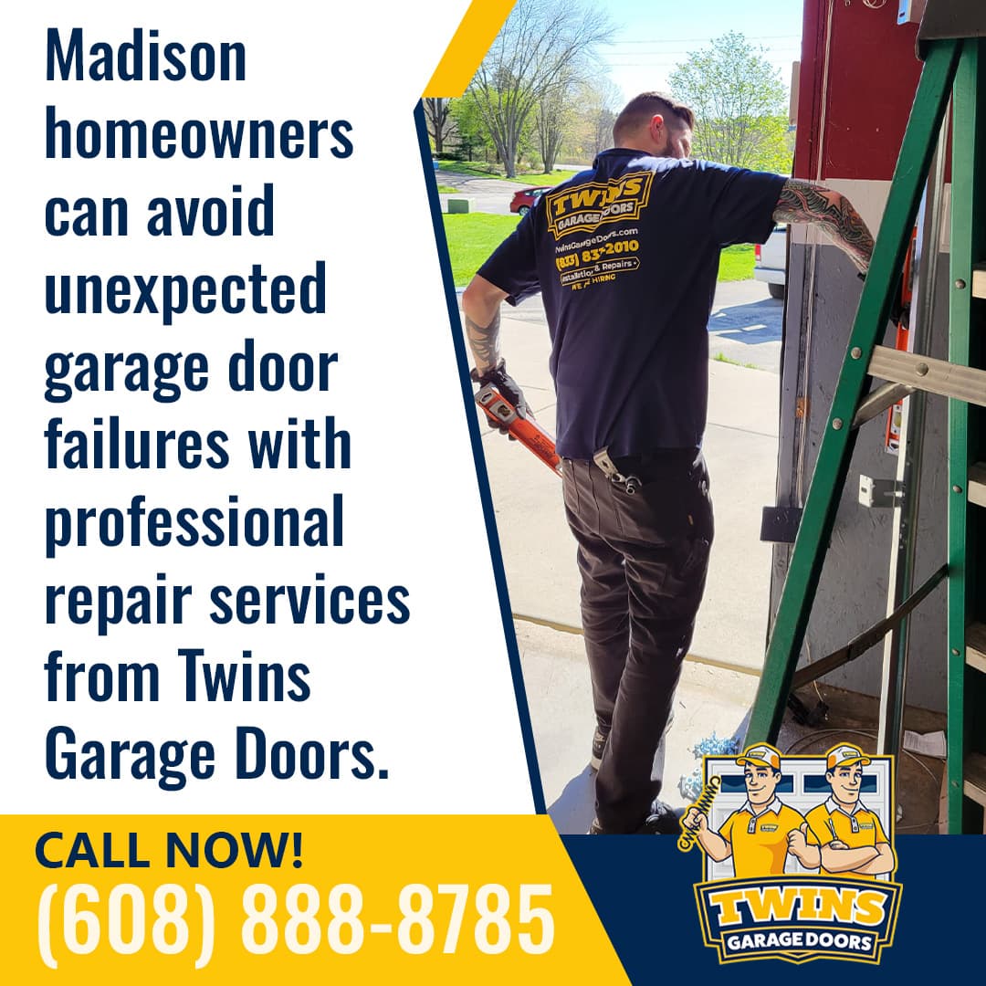 A garage door technician wearing a Twins Garage Doors uniform works on a residential garage door near a ladder, holding tools while standing at the entrance of a driveway on a sunny day.