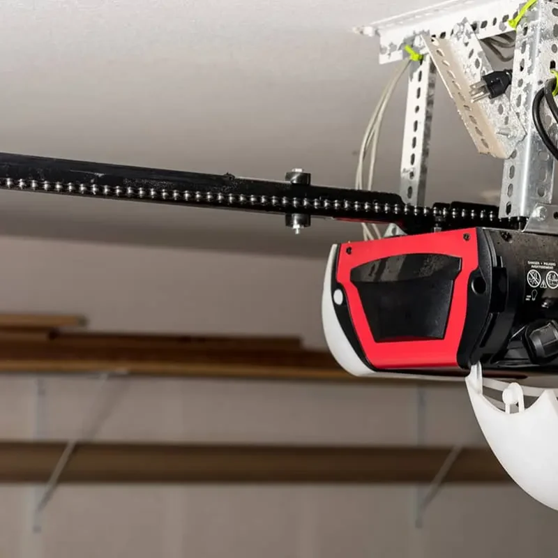 opener with lid open and bulb held by a hand