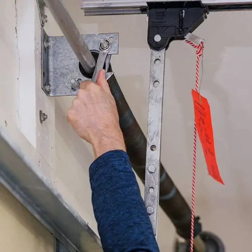 repair garage door spring with wrench