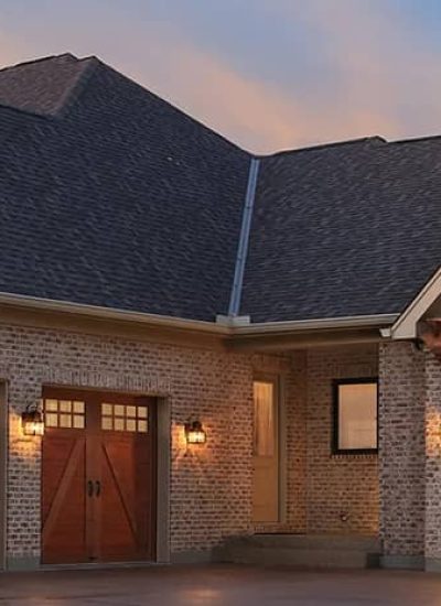 home with garage doors brown color with windows