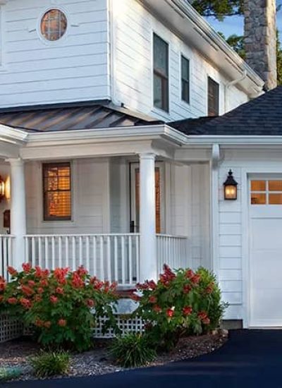 home with white garage doors with windows