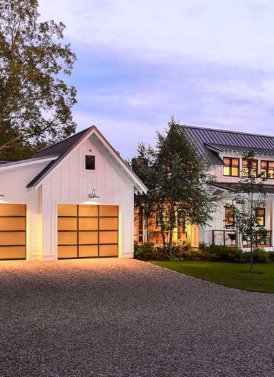 glass garage door and a farm house