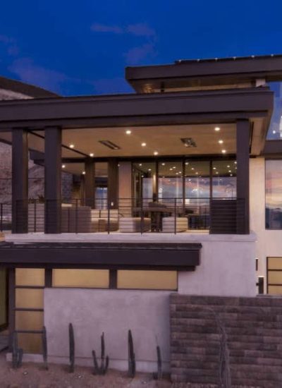 modern house with glass garage doors and glass windows