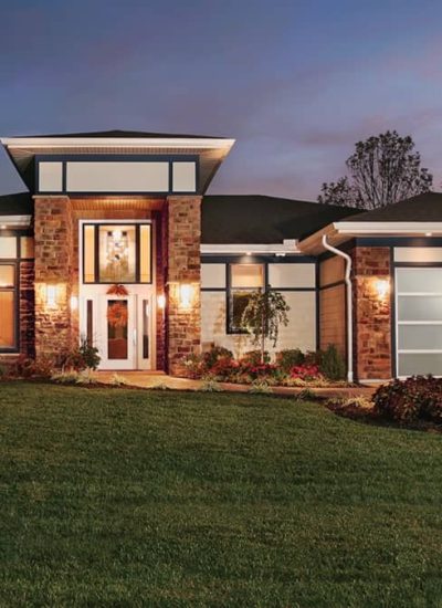 modern house with glass garage doors and glass windows