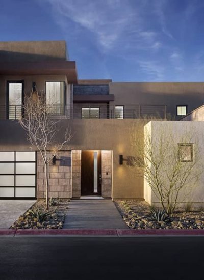 modern house with glass garage doors and glass windows