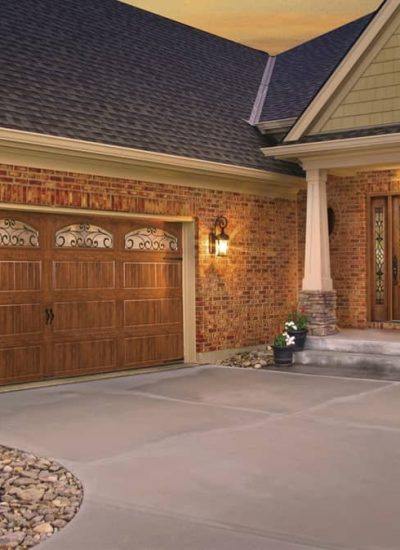 brown garage doors on brick house