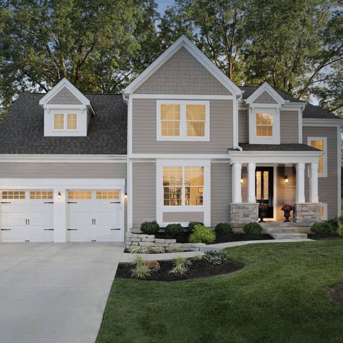 house with 2 white garage doors
