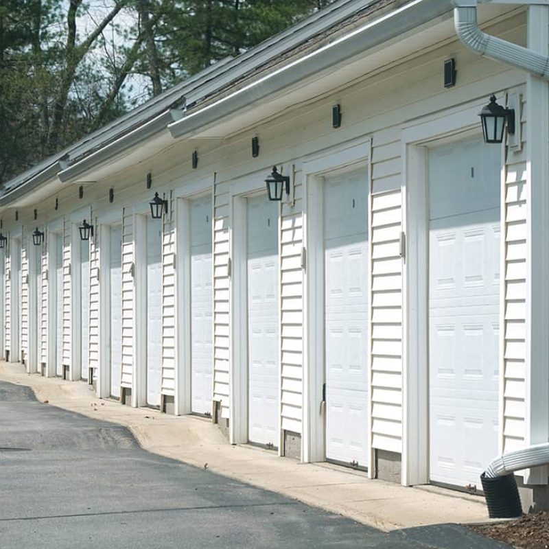 row of white garage doors ina building