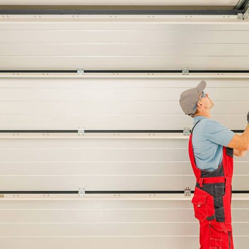 techincian workiing on a garage door