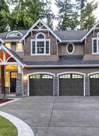 house with three gray garage doors