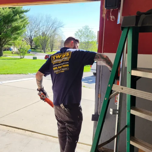 garage door tech taking measurements for a new door