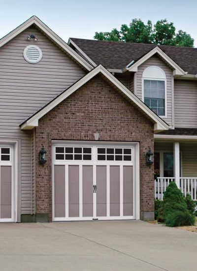 gray home with gray and shite garage doors
