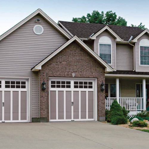 gray home with gray and shite garage doors