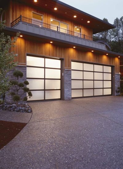 brown home with white and brown garage doors