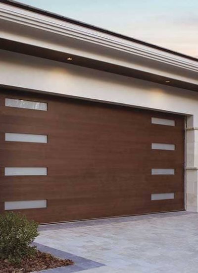 white home with brown garage door